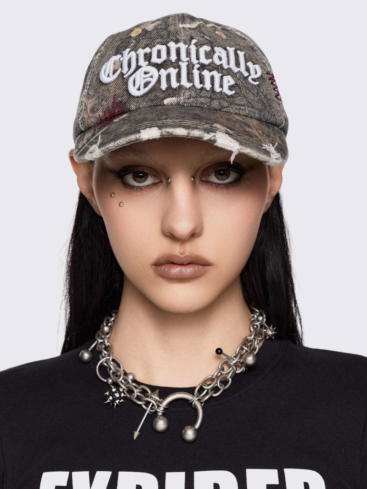 Forest tree como print denim baseball cap with "Chronically online" chunky embroidery and distressed details.