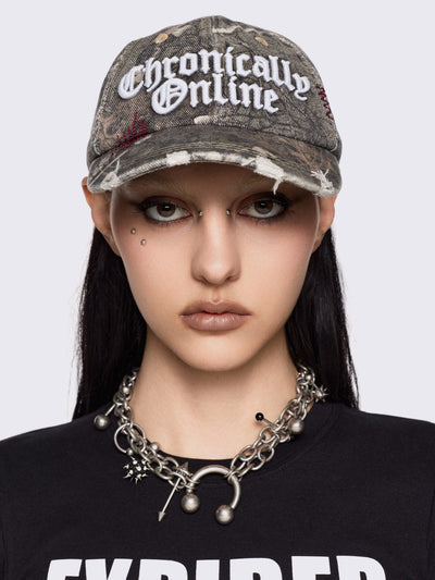 Forest tree como print denim baseball cap with "Chronically online" chunky embroidery and distressed details.