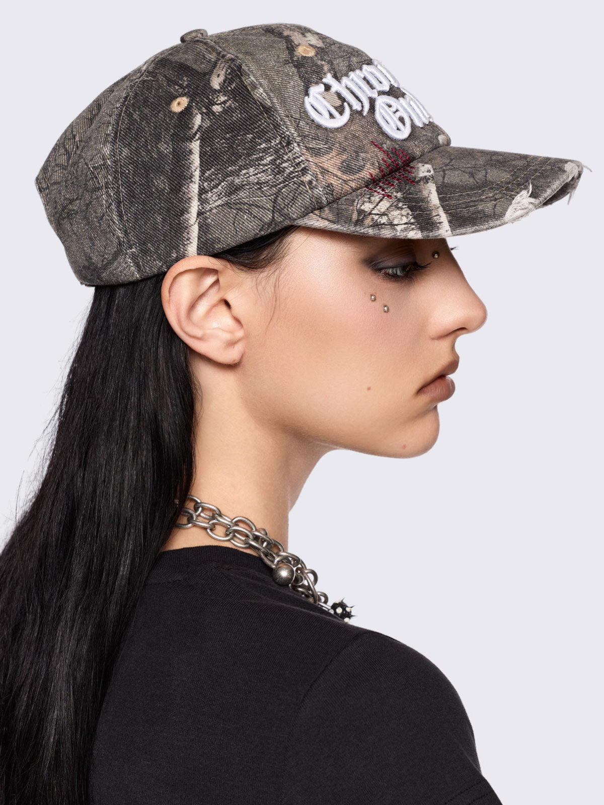 Forest tree como print denim baseball cap with "Chronically online" chunky embroidery and distressed details.
