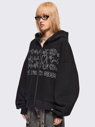 Black zip up hoodie jacket featuring a kaomoji ASCII-style embroidery in white.