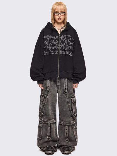 Black zip up hoodie jacket featuring a kaomoji ASCII-style embroidery in white.