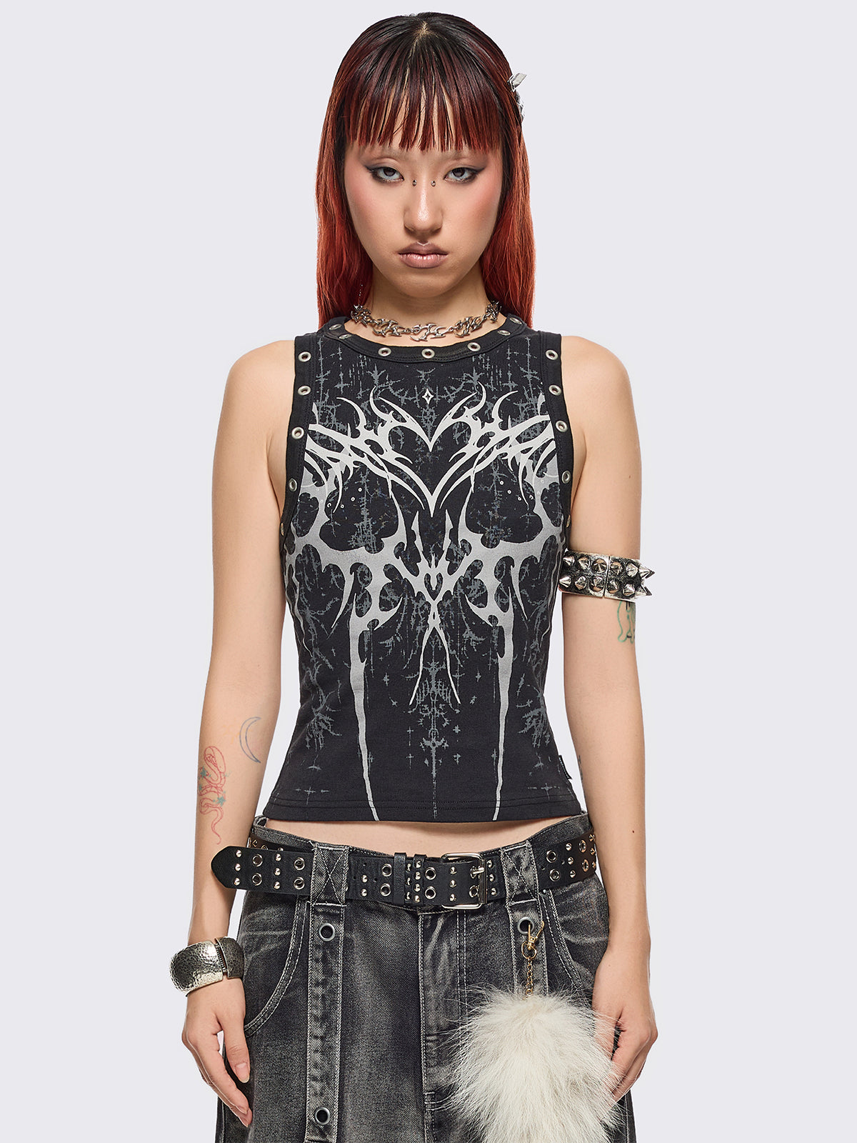 Black tank top with sigilism heart front print and eyelet trim details.