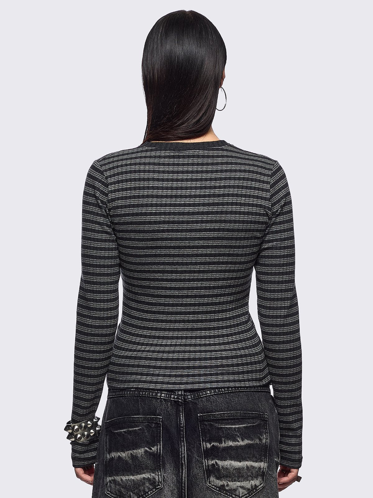 Black and grey striped ribbed long sleeve top featuring a half button placket.