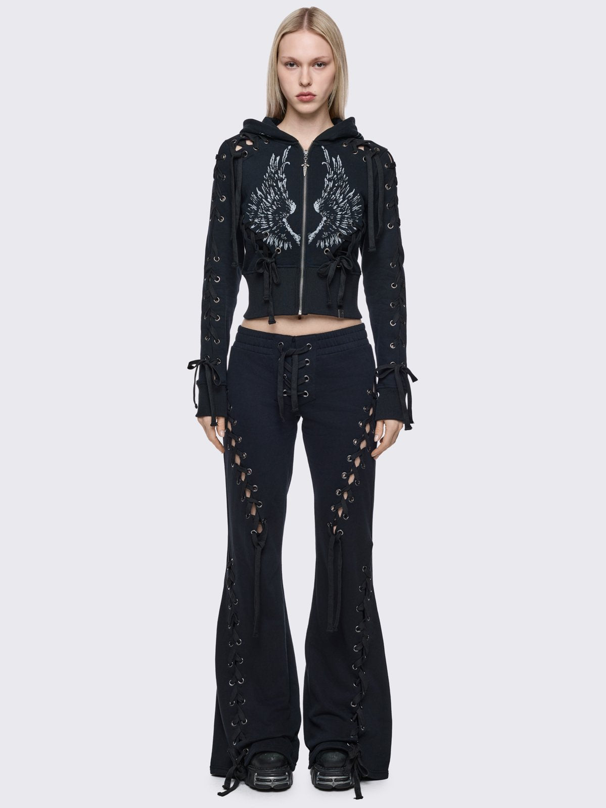 Black flared sweatpants with open lace-up corset details