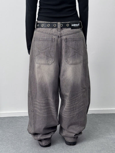 Grey washed super baggy jeans with a relaxed fit, regular waist, zip fly, button fastening, and belt loops. Trendy streetwear style.