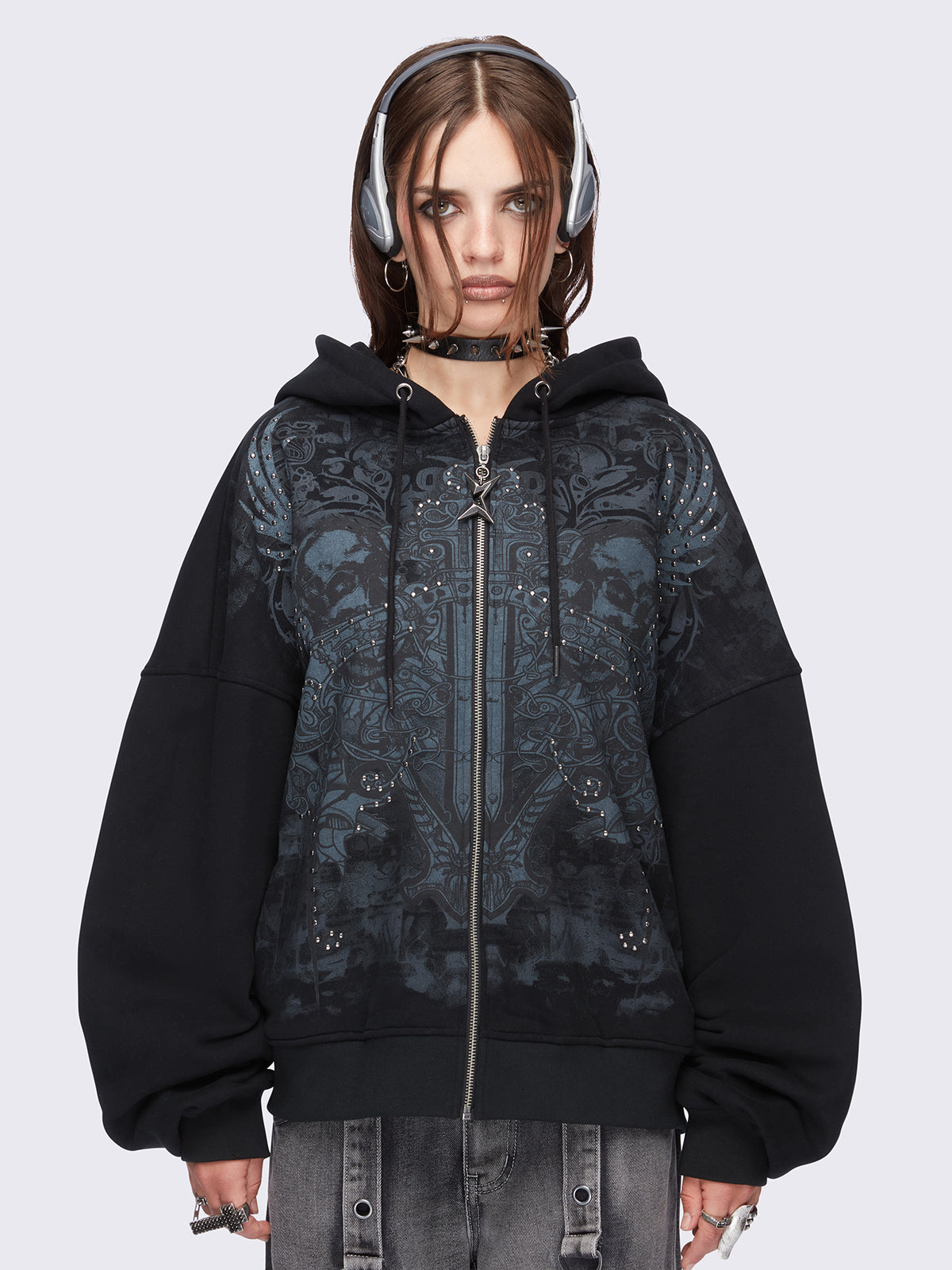 Black zip up hoodie jacket featuring a grunge graphic front print and silver stud details.