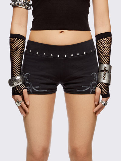 Black sweat micro shorts with silver studs in waistline and sigilism graphic print on sides. 