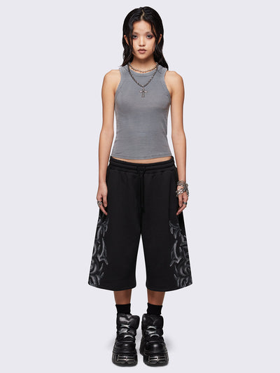 Black oversized longline sweat shorts with sigilism graphic print.