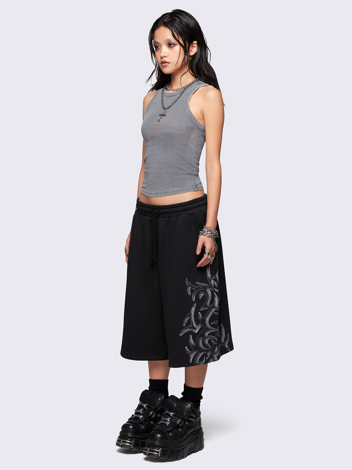 Black oversized longline sweat shorts with sigilism graphic print.