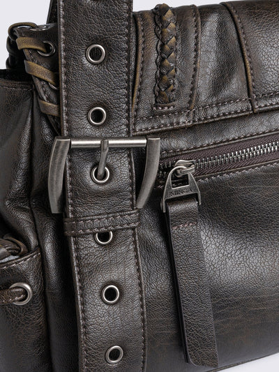 Brown faux leather shoulder bag featuring lace ups, eyelets, buckles and multiple pockets.