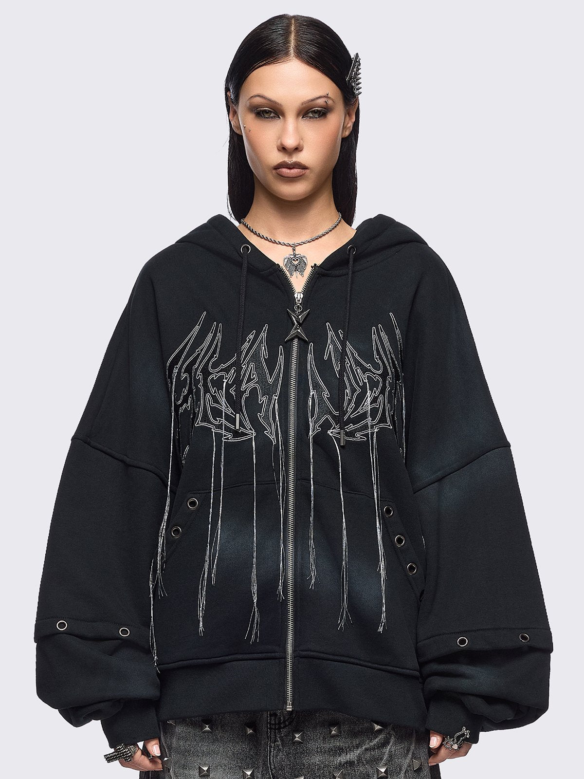 Black washed layered zip up hoodie with floppy ears hood, "Heaven" embroidery and silver eyelet details.