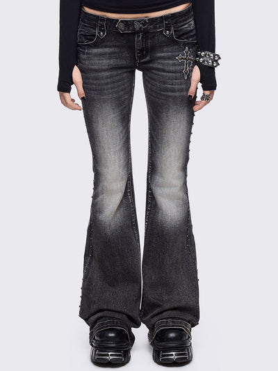 Black washed flared jeans featuring wings back and cross front embroideries and stud trim and details