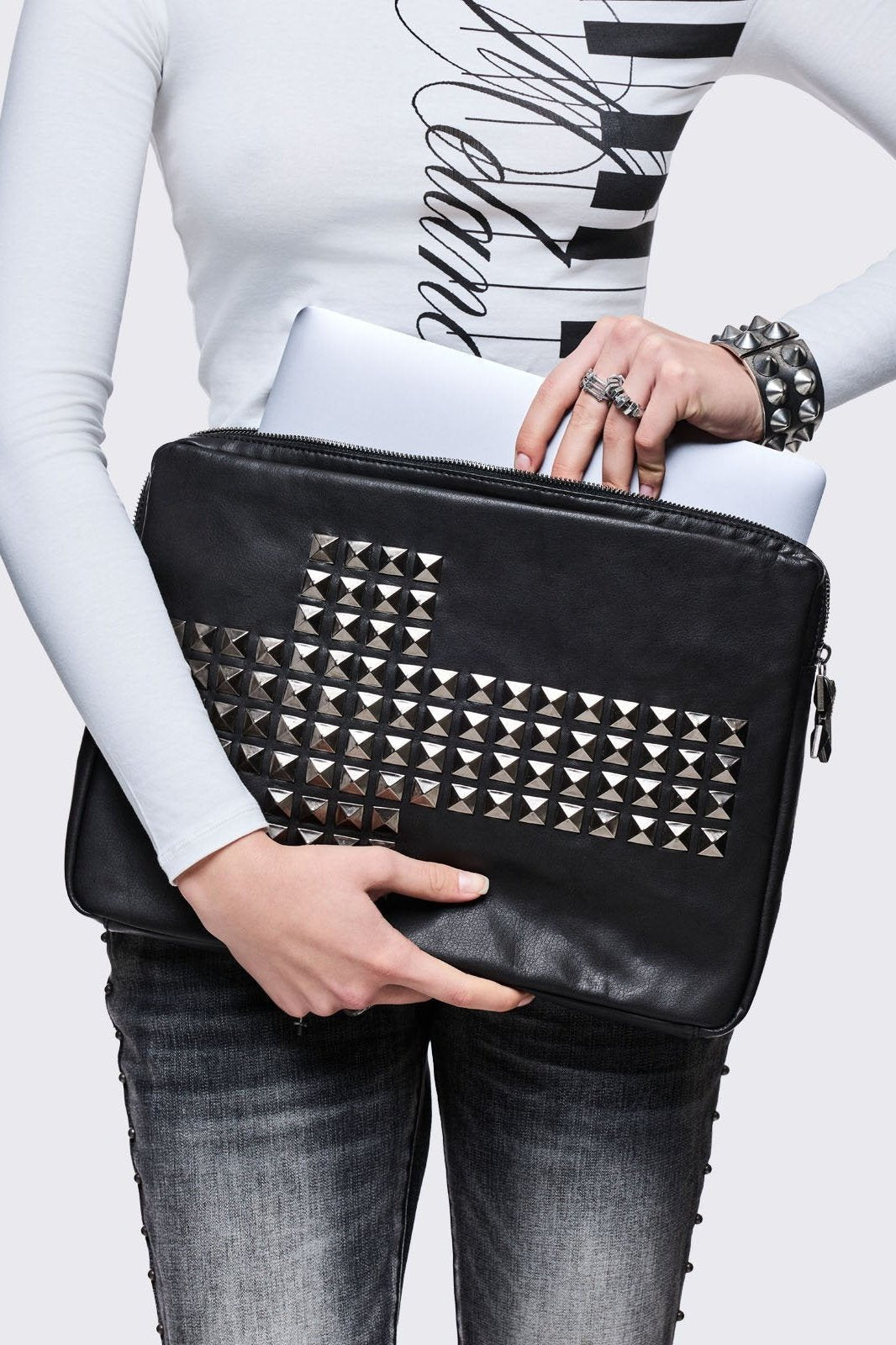 Black faux leather laptop sleeve with studded cross design
