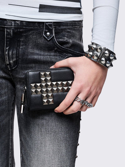 Black faux leather wallet with studded cross design.
