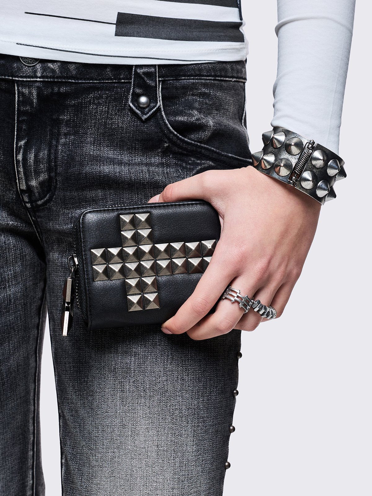 Black faux leather wallet with studded cross design.