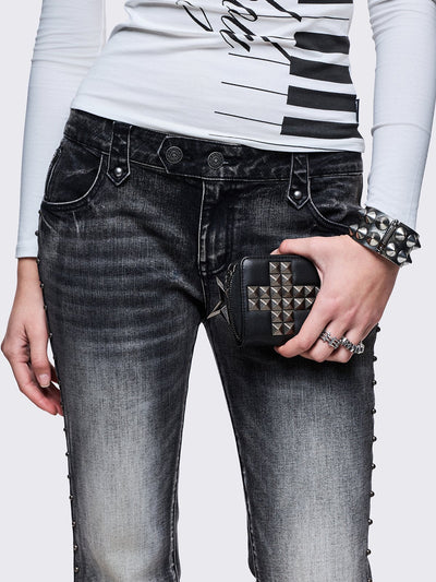 Black faux leather wallet with studded cross design.