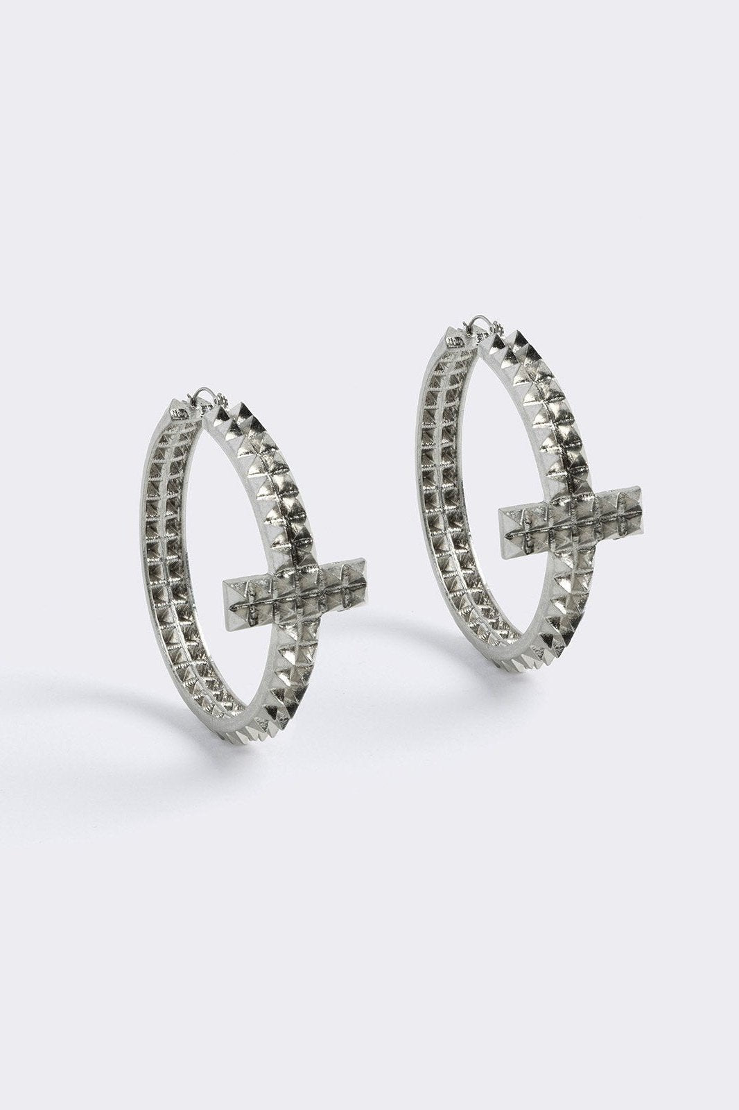 Silver chunky studded cross hoop earrings.