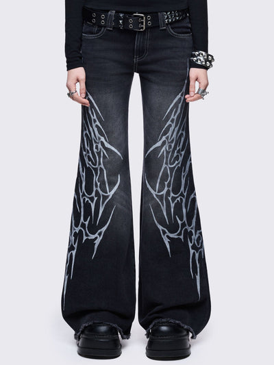 Black washed flared jeans with sigilism side print.