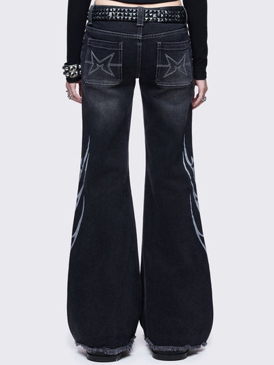 Black washed flared jeans with sigilism side print.