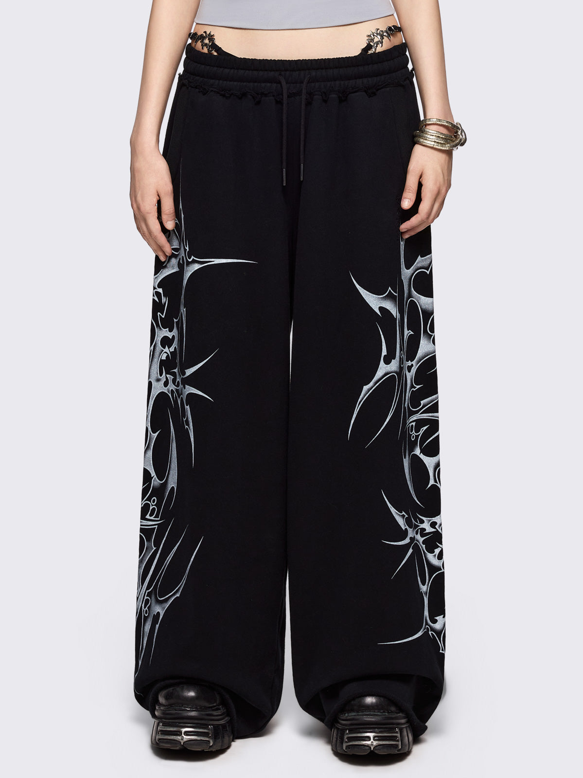 Black wide leg sweatpants with off-white sigilism graphic side print.