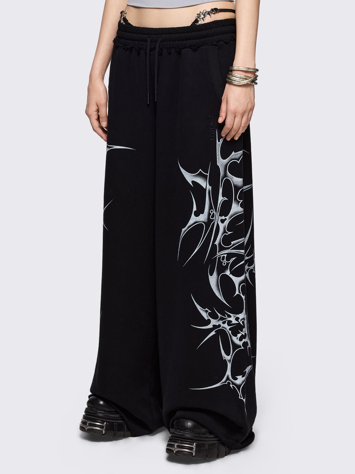 Black wide leg sweatpants with off-white sigilism graphic side print.