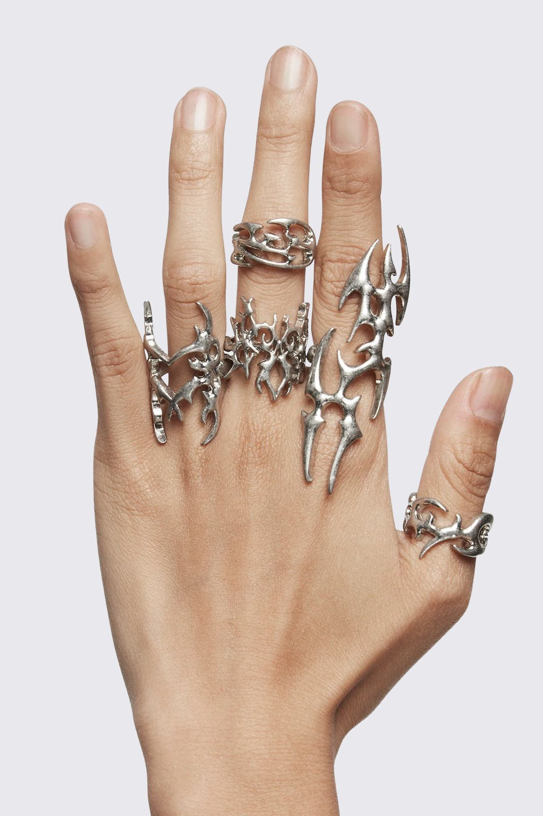 Set of 5 silver rings with sigilism tribal designs.