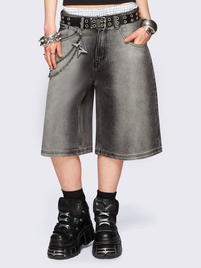 Black washed longline denim jorts featuring a grey overdye, removable chain, wide-leg fit and knee-length cut.