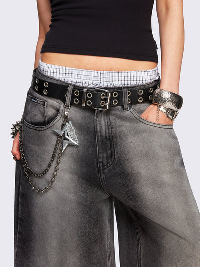 Black washed longline denim jorts featuring a grey overdye, removable chain, wide-leg fit and knee-length cut.