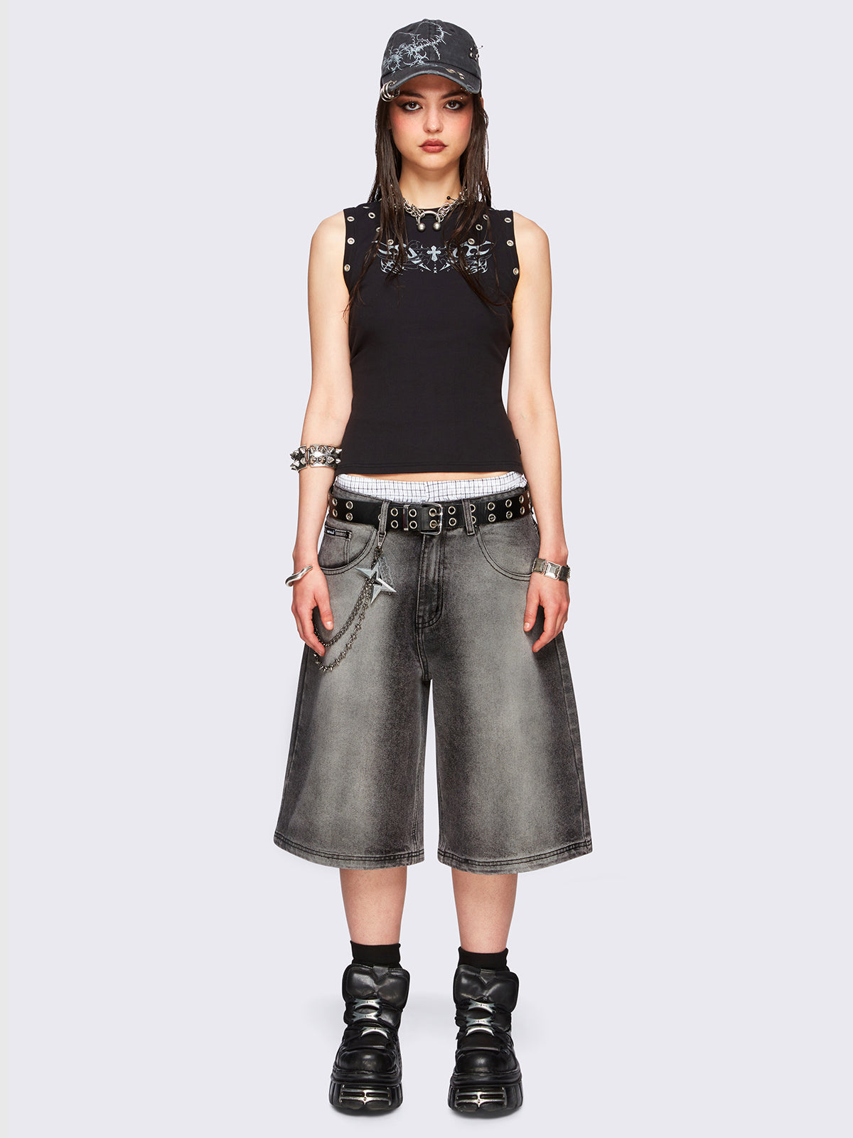 Black washed longline denim jorts featuring a grey overdye, removable chain, wide-leg fit and knee-length cut.