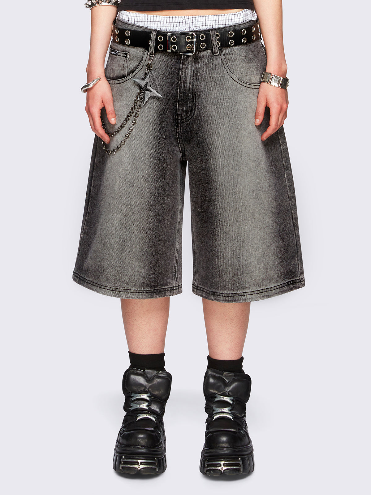 Black washed longline denim jorts featuring a grey overdye, removable chain, wide-leg fit and knee-length cut.