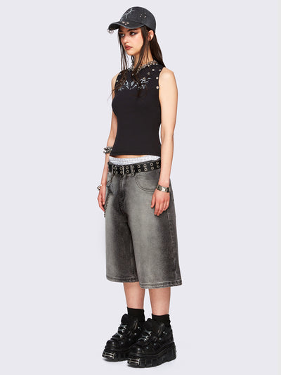 Black washed longline denim jorts featuring a grey overdye, removable chain, wide-leg fit and knee-length cut.