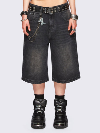 Black washed longline denim jorts with removable chain and wide-leg fit and knee-length cut.