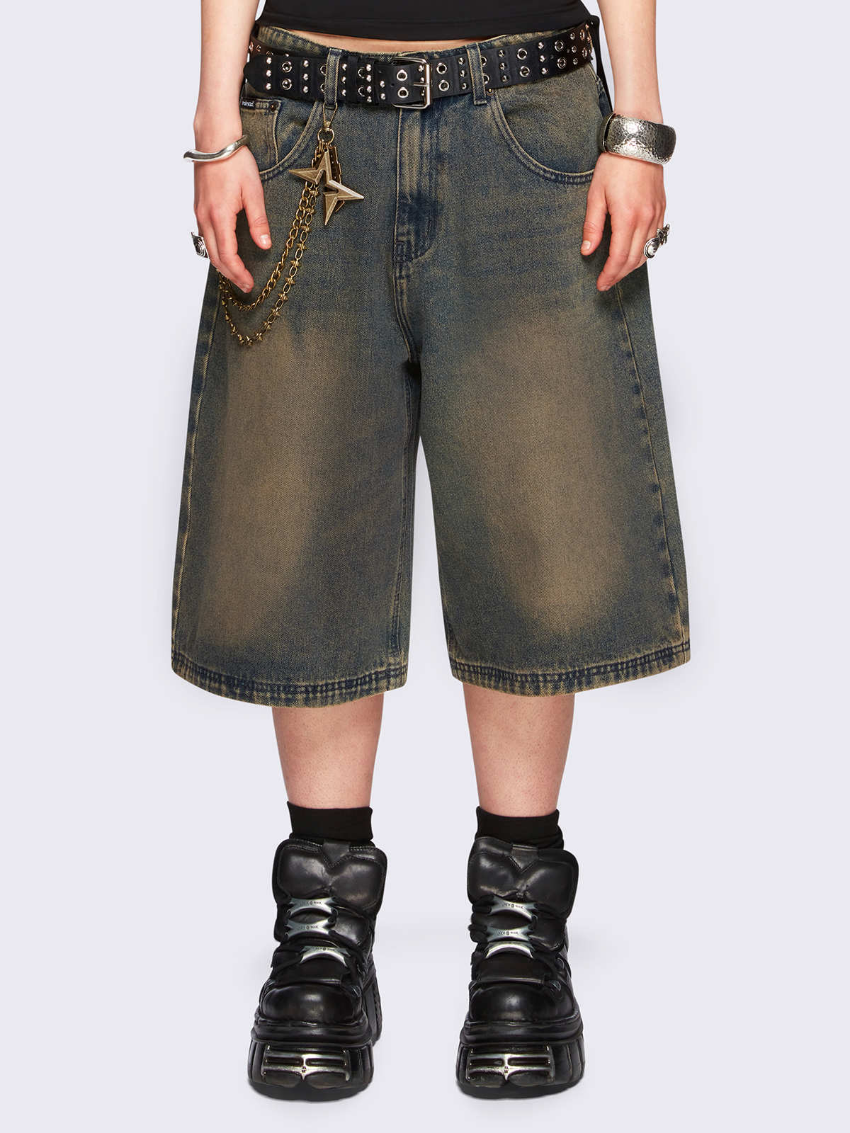Blue washed longline denim jorts featuring a green overdye, removable chain, wide-leg fit and knee-length cut.