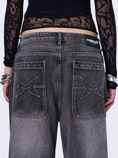 Black washed baggy jeans with grey overdye and cross panels and seams details. 