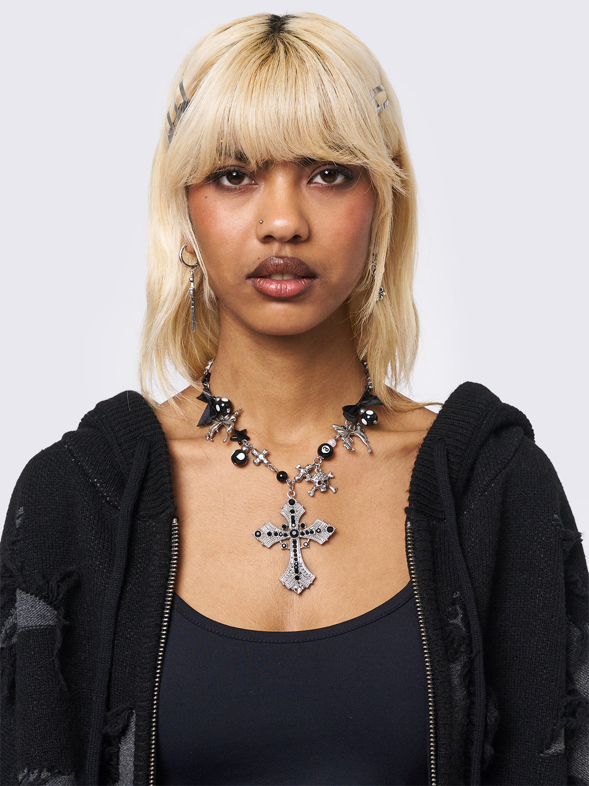 Black beaded necklace with cross pendant and more detail