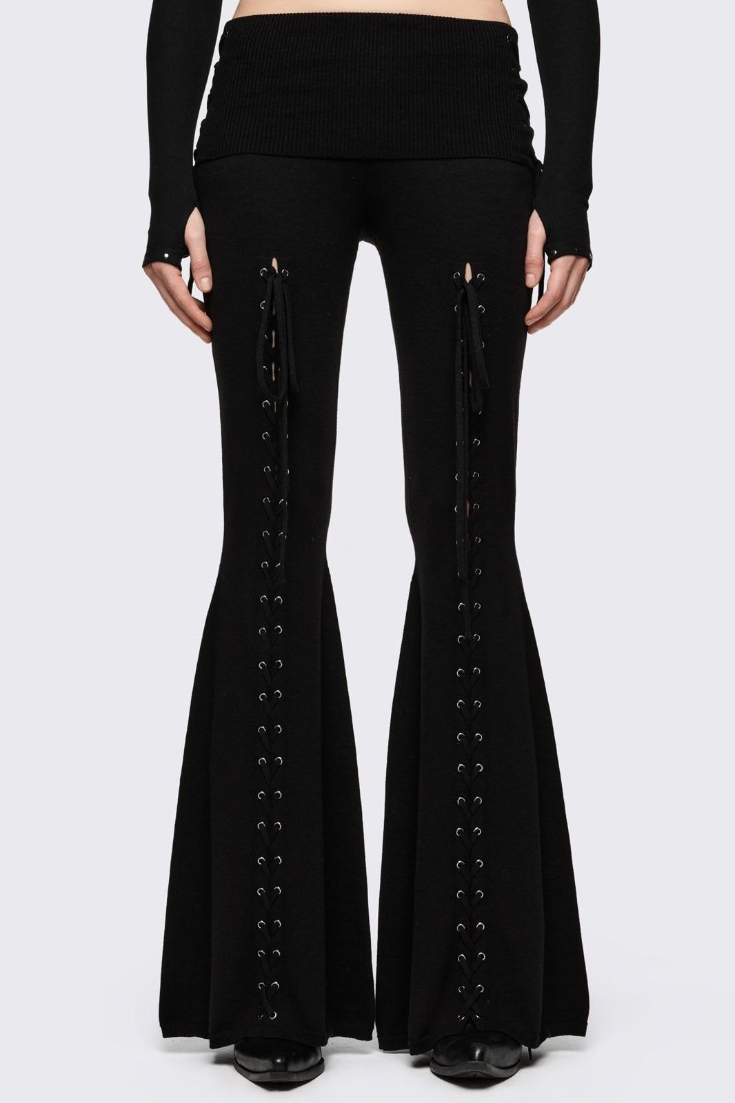 Black flare pants with front open lace-up corset details. 