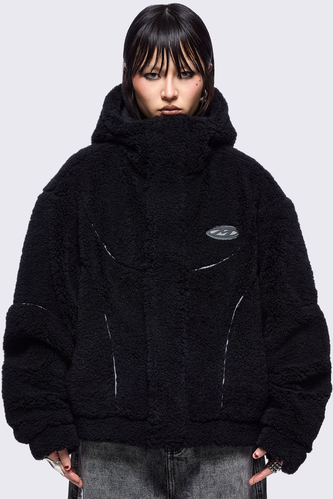 Black fleece hoodie jacket featuring grey piping and high neck hood.