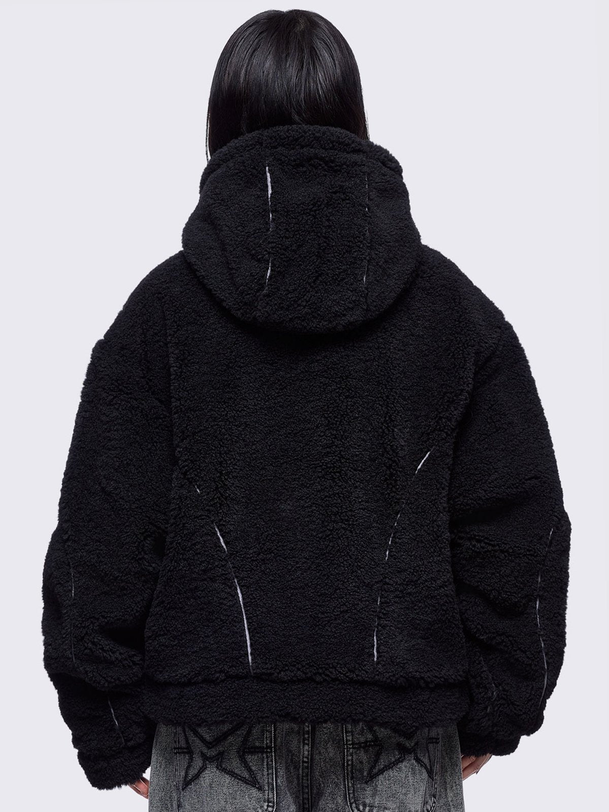 Black fleece hoodie jacket featuring grey piping and high neck hood.