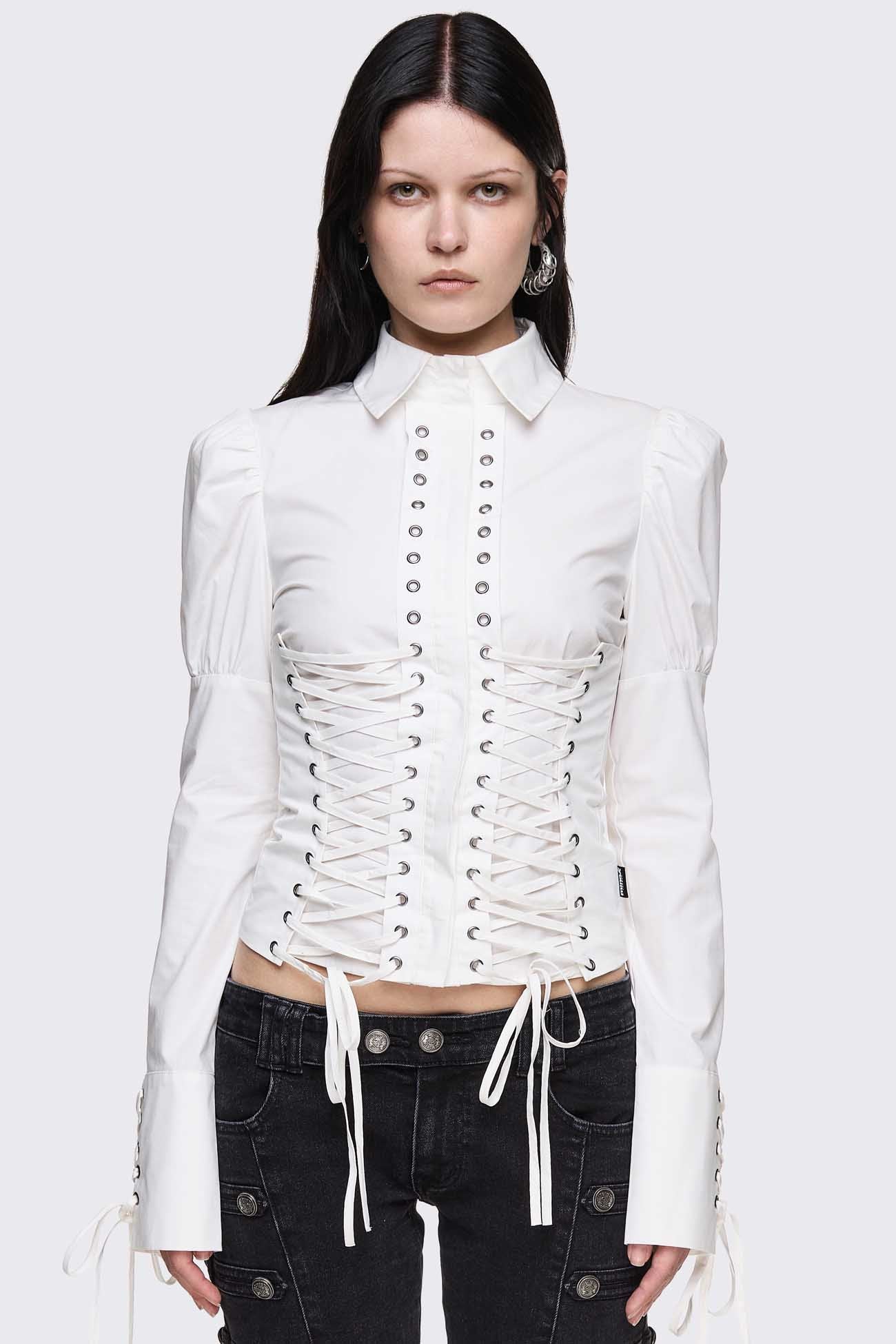 White cotton shirt with corset lace-up panels, puffed shoulders and eyelet details in a whimigoth style.