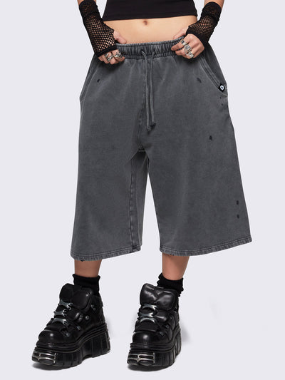 Grey washed longline sweat shorts featuring a distressed details, signature embroidered back pocket detail, elasticated drawstring waist and oversized fit.