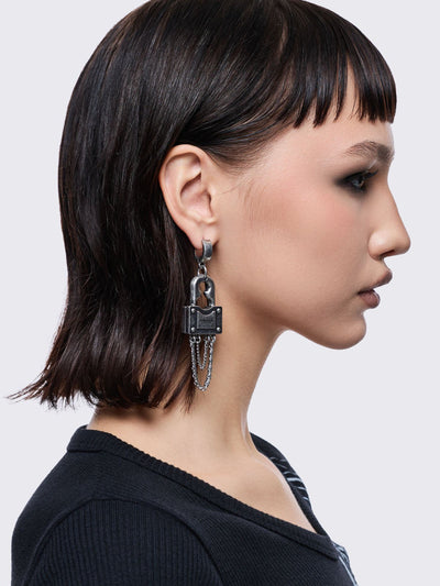 Chunky silver padlock pendant hoop earrings.