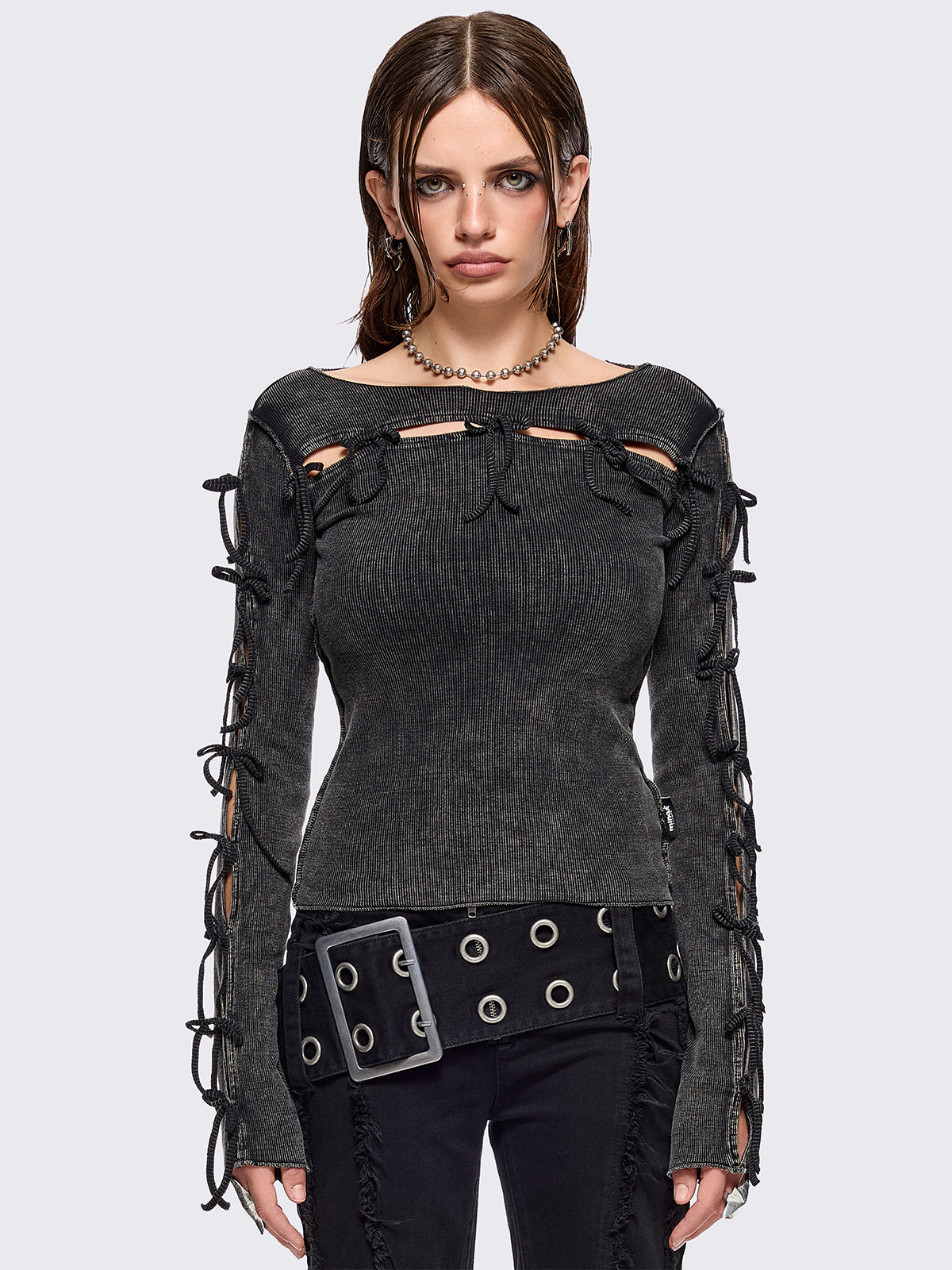 Black washed rib top with cut-out and bow details.