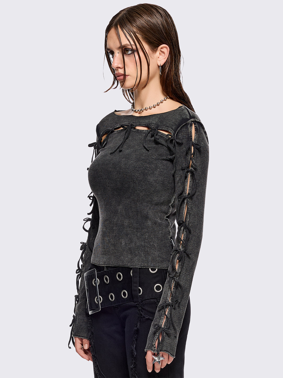 Black washed rib top with cut-out and bow details.