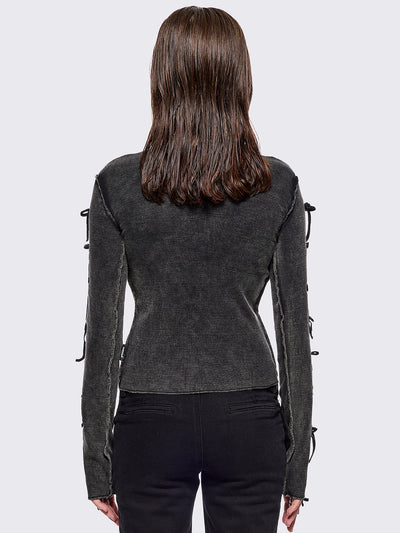 Black washed rib top with cut-out and bow details.