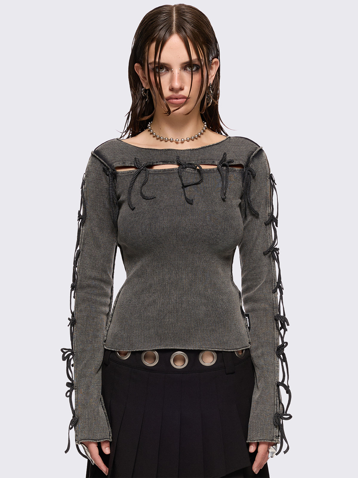 Grey washed rib top with cut-out and bow details.