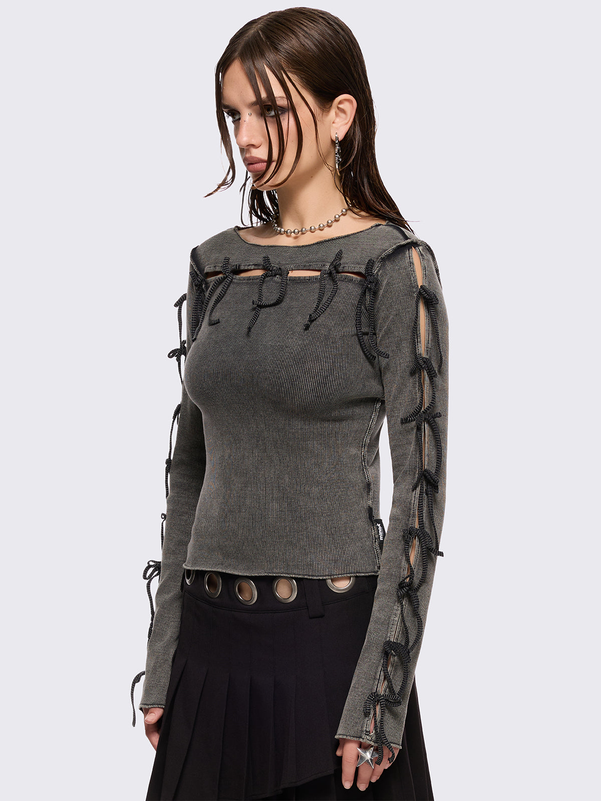 Grey washed rib top with cut-out and bow details.