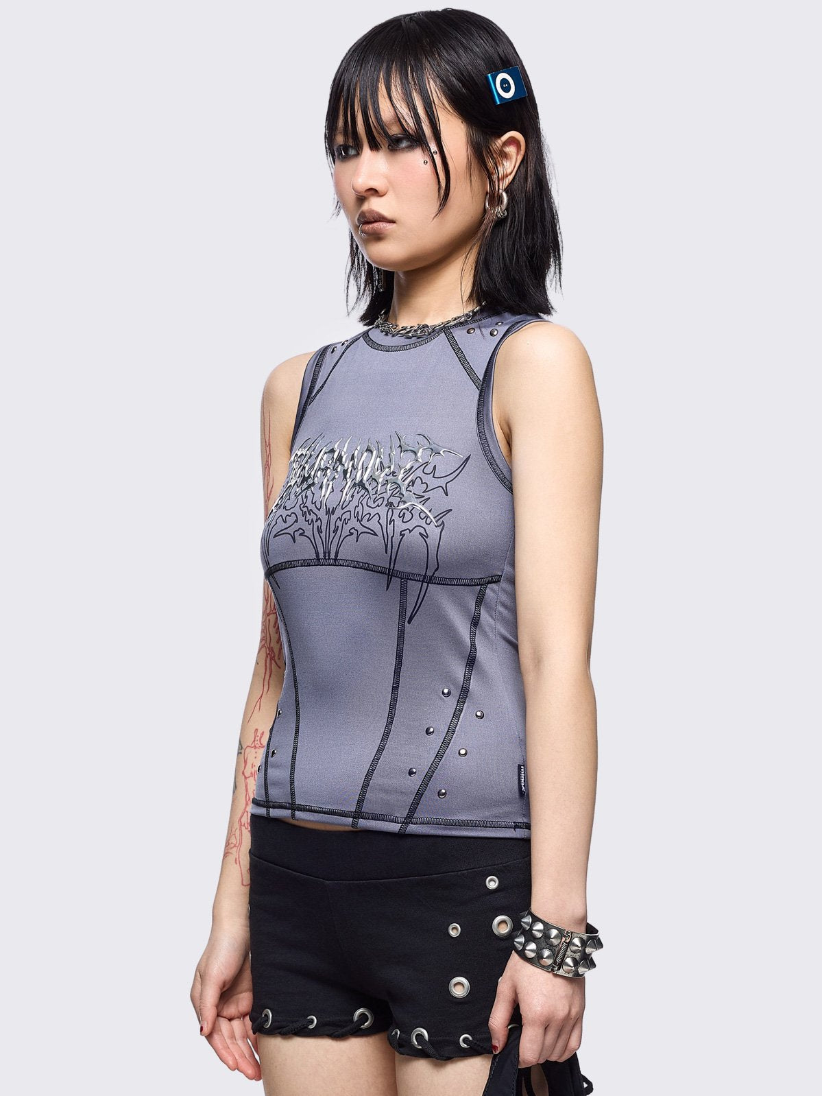 Grey vest top with metal embossed and black sigilism graphic print, stud details and black contrast stitching.
