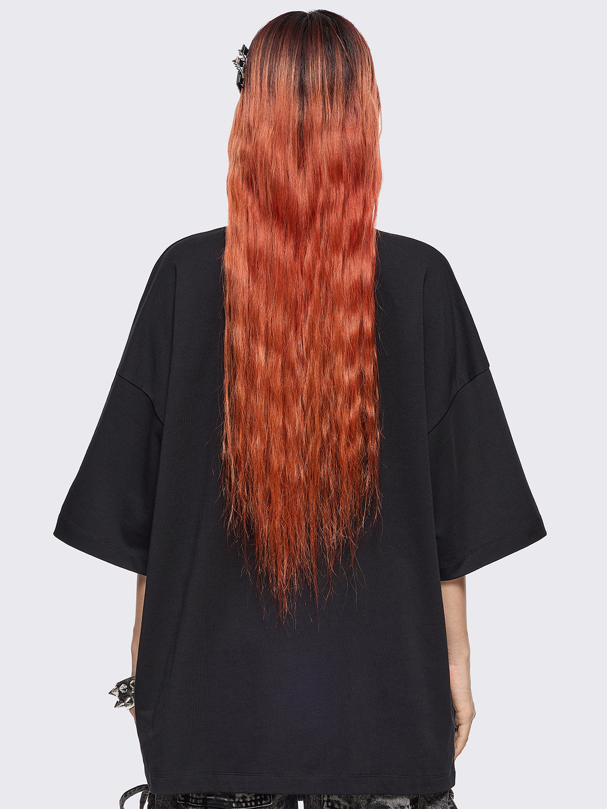 Black oversized t-shirt with "when u lowkey weird but tehy stil fw u" graphic print, kaomoji ASCII-style embroideries and stud details.