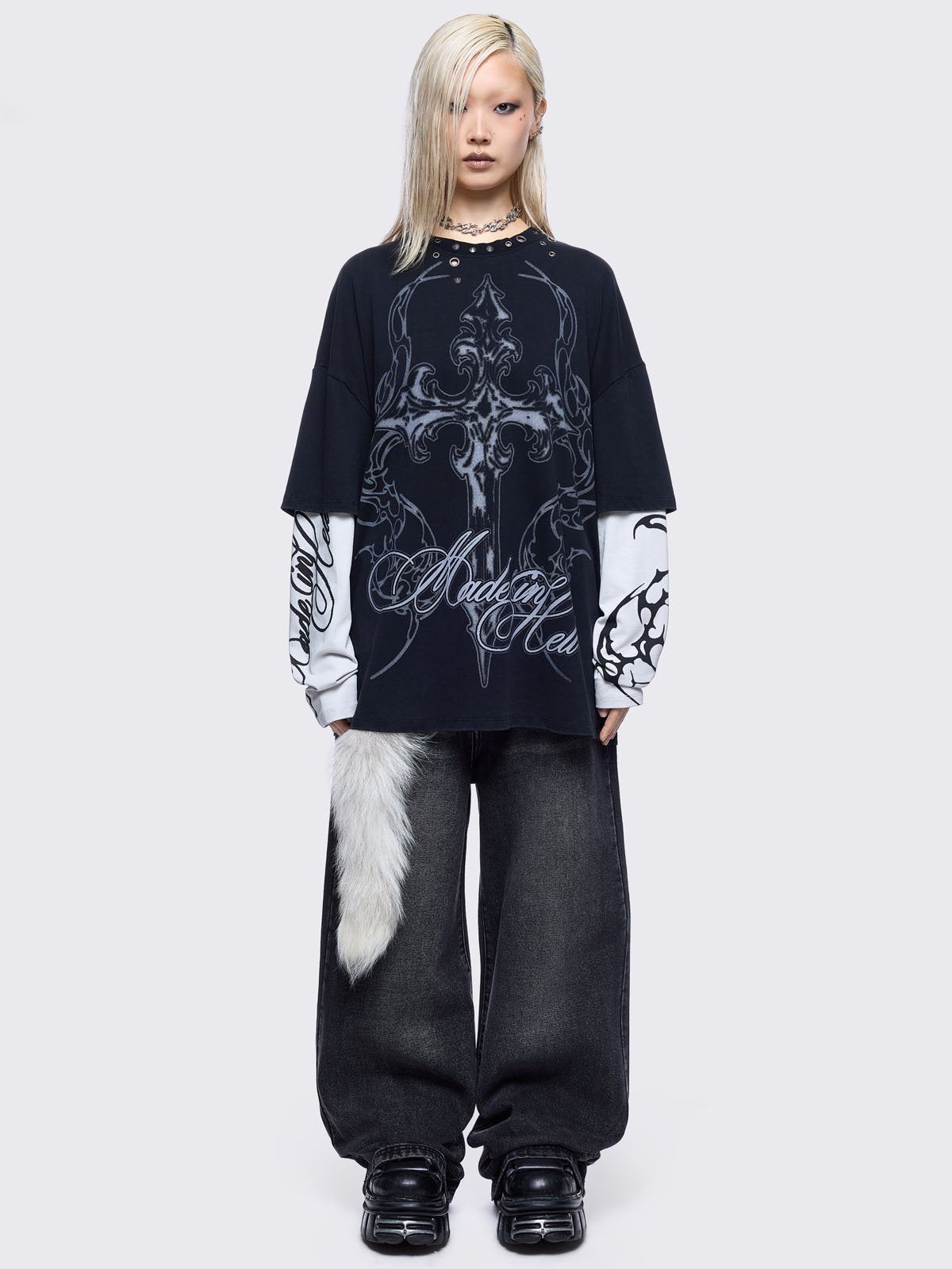 Black washed layered long sleeve t-shirt featuring "Made in hell" and cross graphic print, contrast off-white sleeves with sigilism print and silver eyelet and spike details.