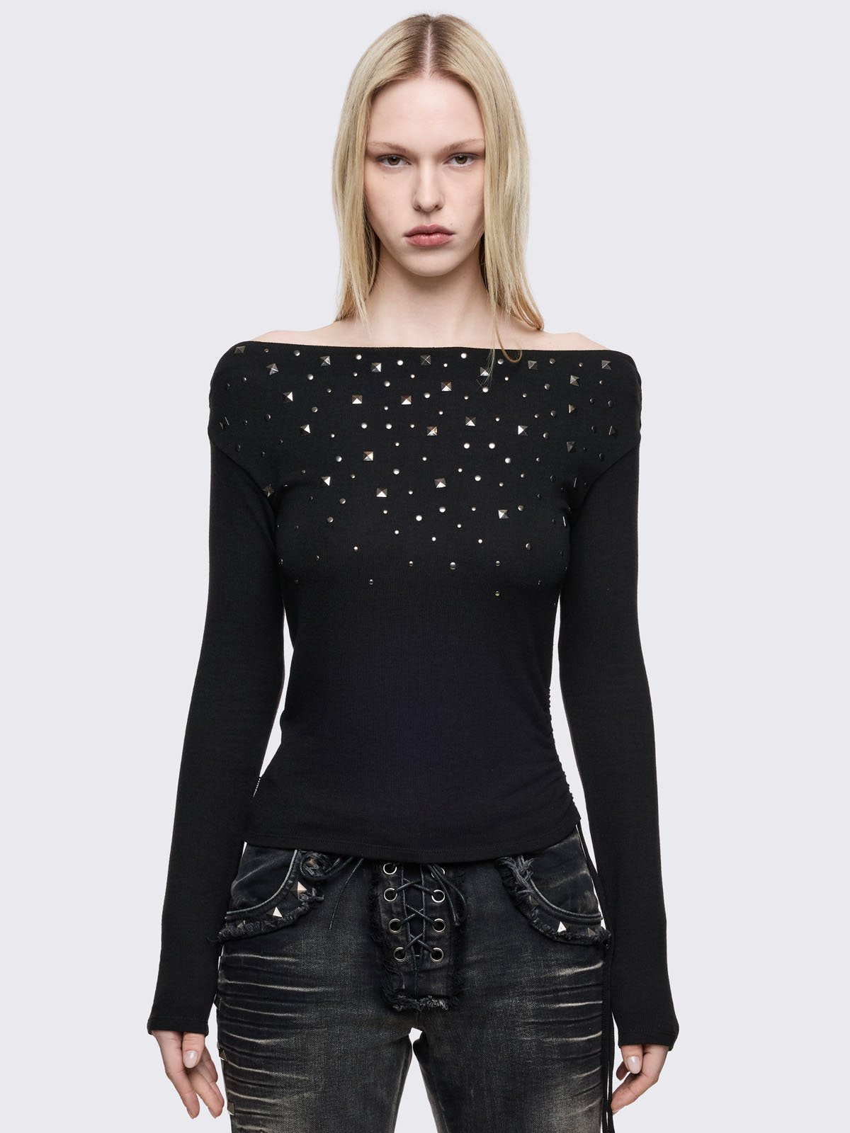 Black long sleeve top with stud details and off-shoulder style.